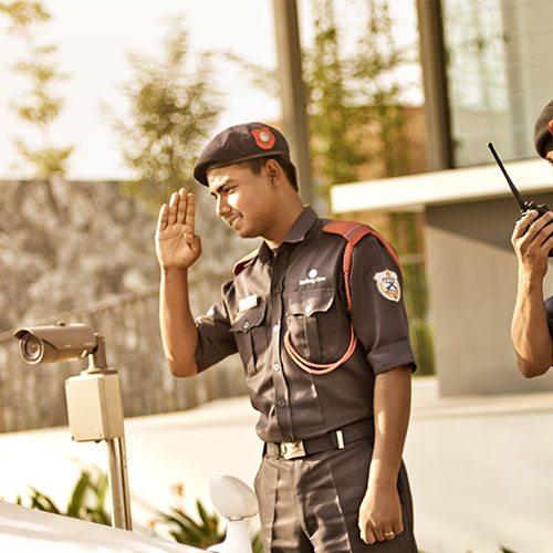 Two Senibong Cove security personnel at a security checkpoint